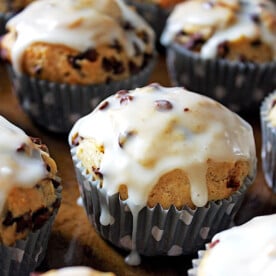 Banana walnut chocolate chip muffins covered in glaze.