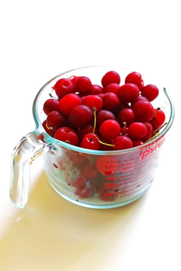 Tart cherries in a clear pyrex measuring cup