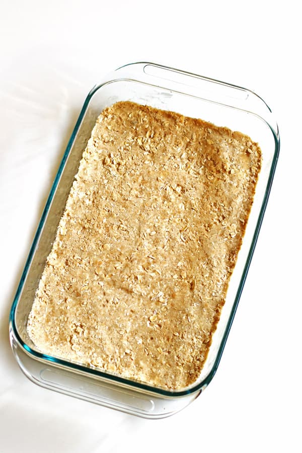 Oat and flour crust in clear 13 x 9 baking pan
