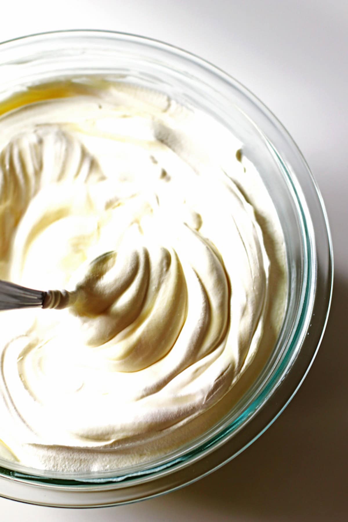 Pudding mixture in bowl with spoon