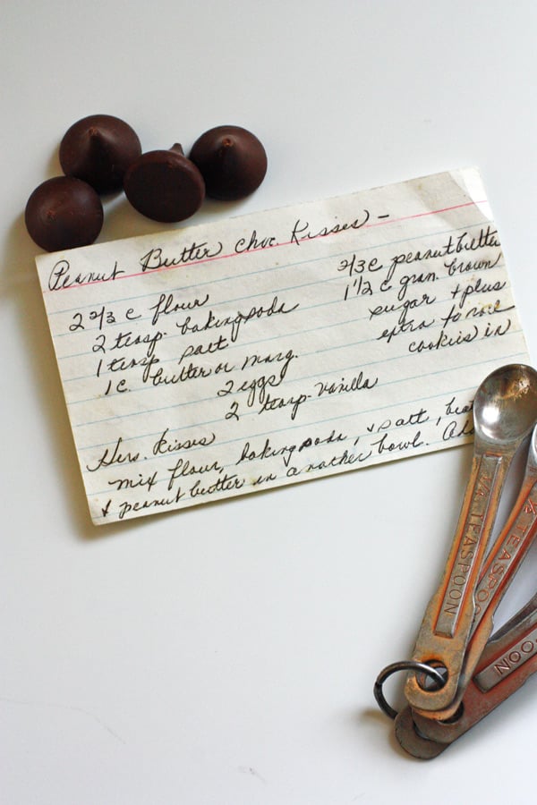 Recipe card hand written out sitting on white counter top