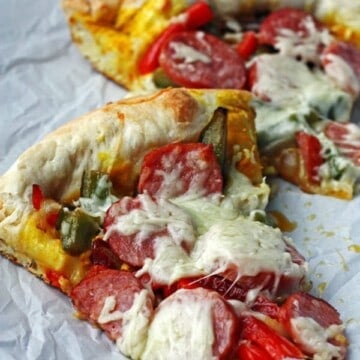 Slices of Supreme Pizza on parchment paper