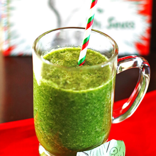 A green smoothie made with orange, banana, greens, water, & flaxseed.