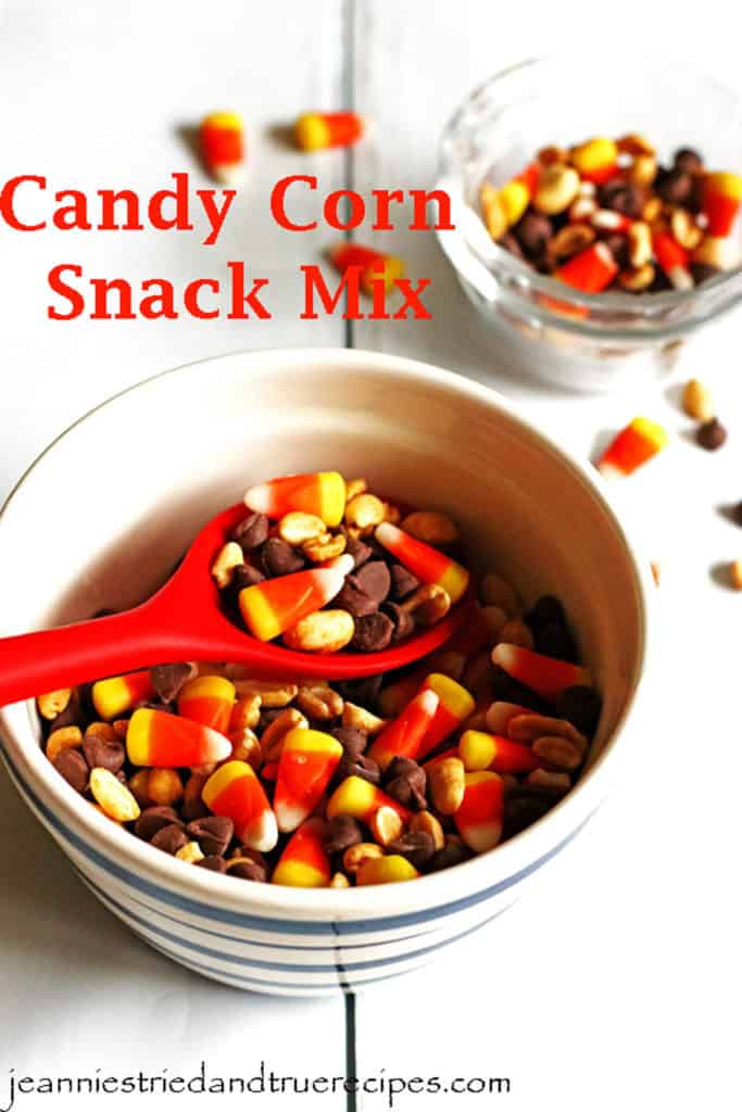 Candy Corn Snack Mix in a bowl with the snack being served with a red spoon. There is a small dish with the snack in it.