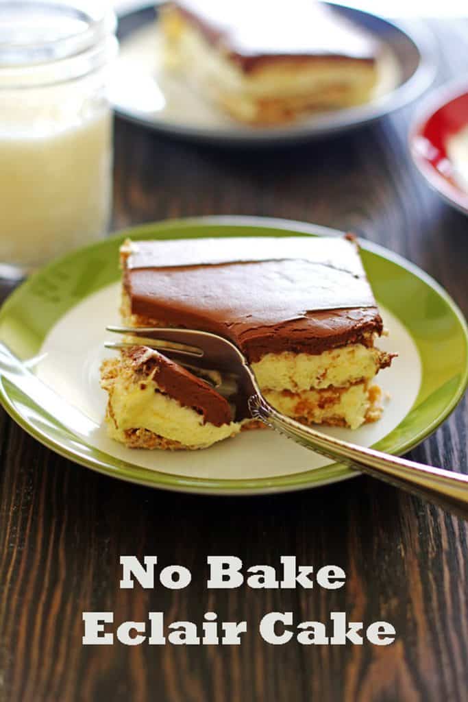 Slice of Eclair Cake on white and green plate with a fork and glass of milk