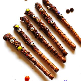 Pretzel Rods that were dipped in melted chocolate and crushed up candy and edible eyes added to them.