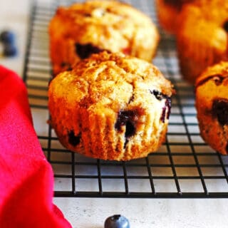 Blueberry Banana Muffins on a black cooling rack