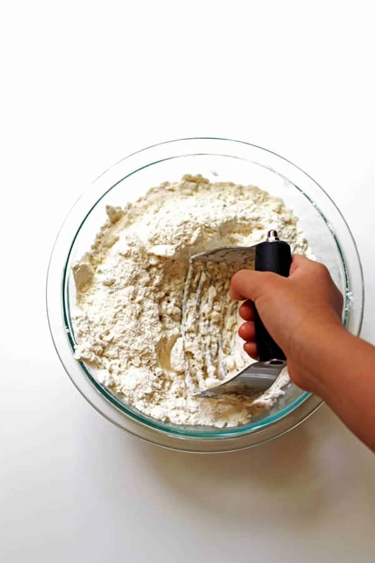 Combining flour with other dry ingredients with a pastry blender