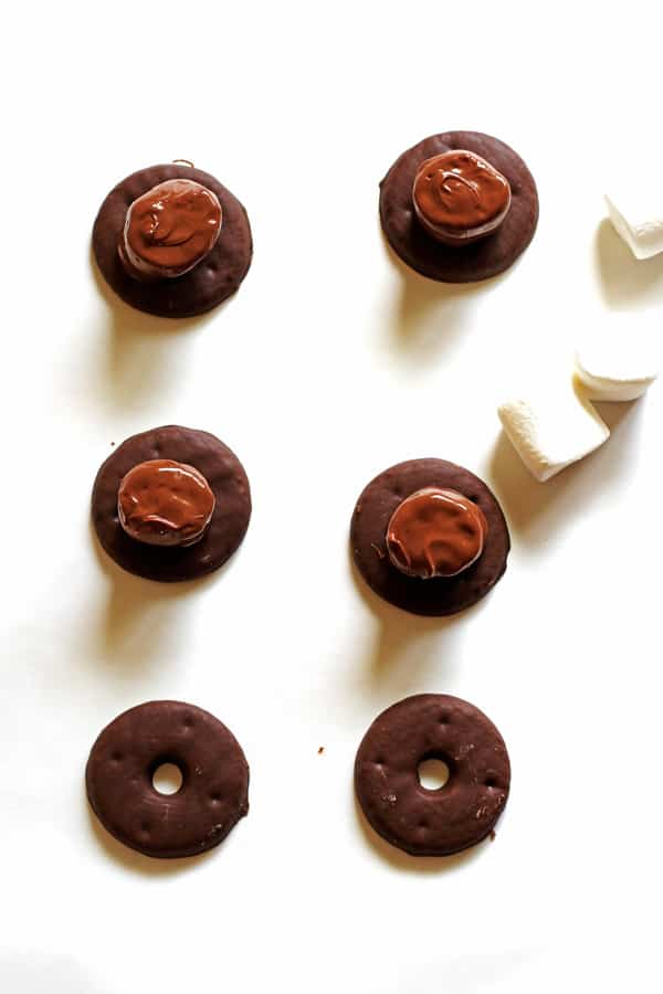 Chocolate covered marshmallows on top of cookies