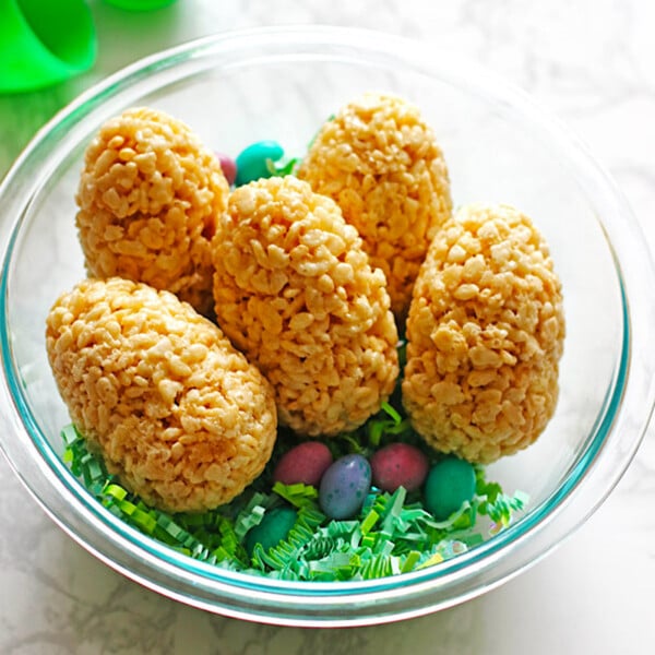 Rice Krispie Treats in the shape of eggs in a glass bowl