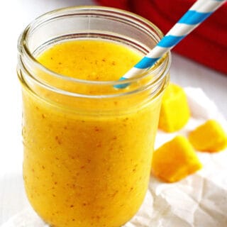 Smoothie made from pineapple, mango and banana in a canning jar