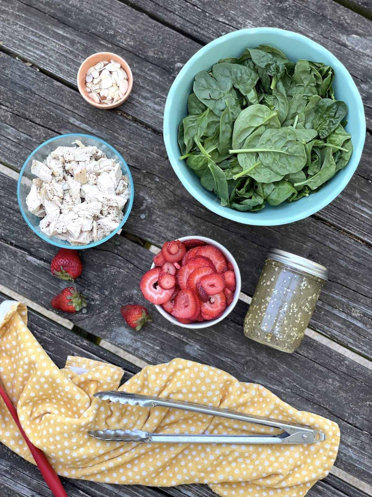 The ingredients in strawberry spinach chicken salad, laid out.