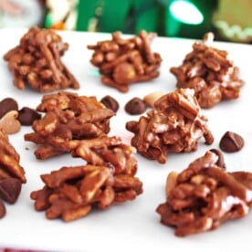 Chocolate chow mein haystack cookies on a white plate.