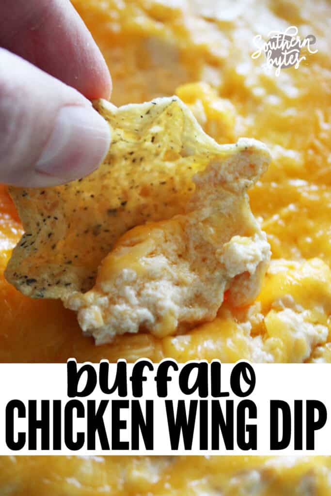 A pin image of a corn chip scooping up cheesy buffalo chicken dip.