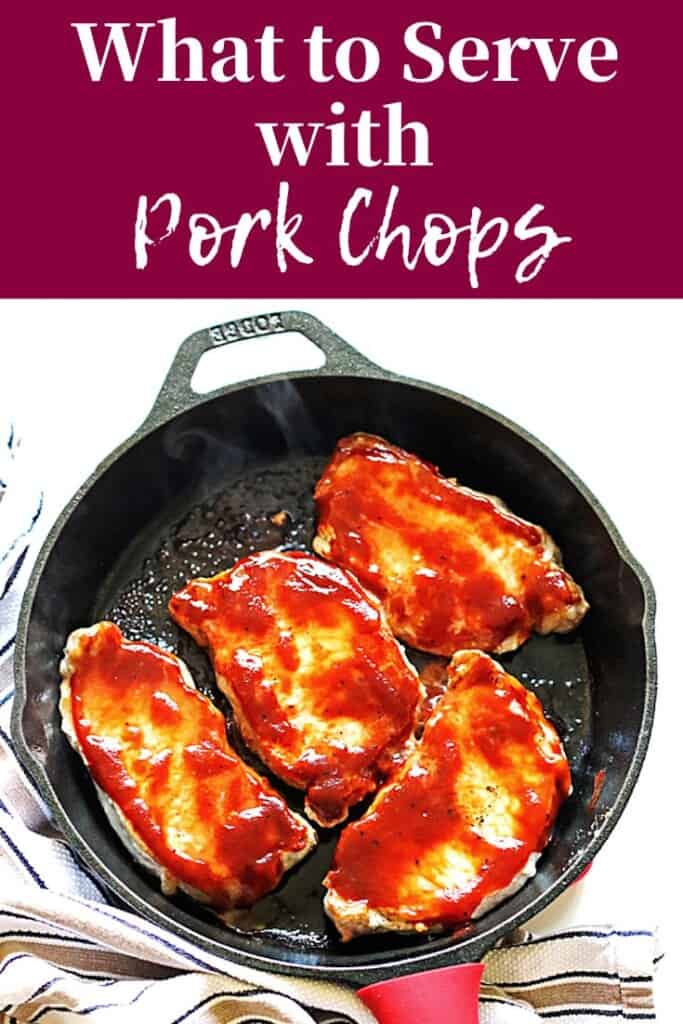 A pin image of a cast iron pan with pork chops in it.