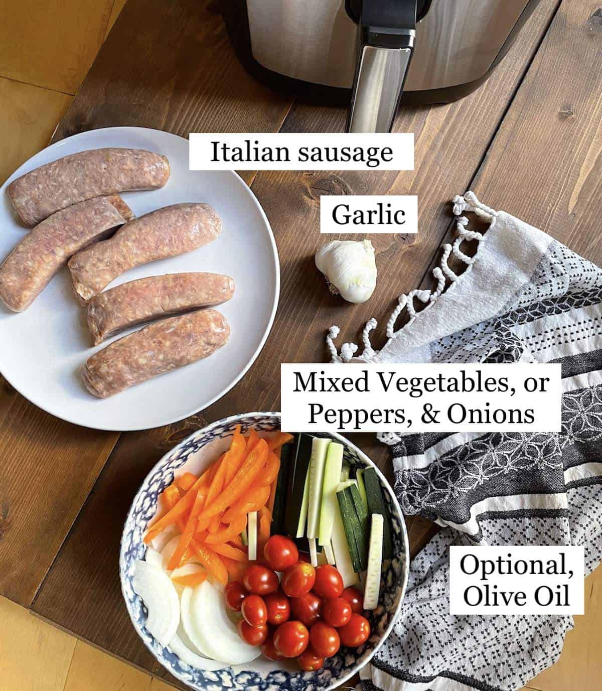 The ingredients in air fryer Italian sausage and peppers laid out and labeled.