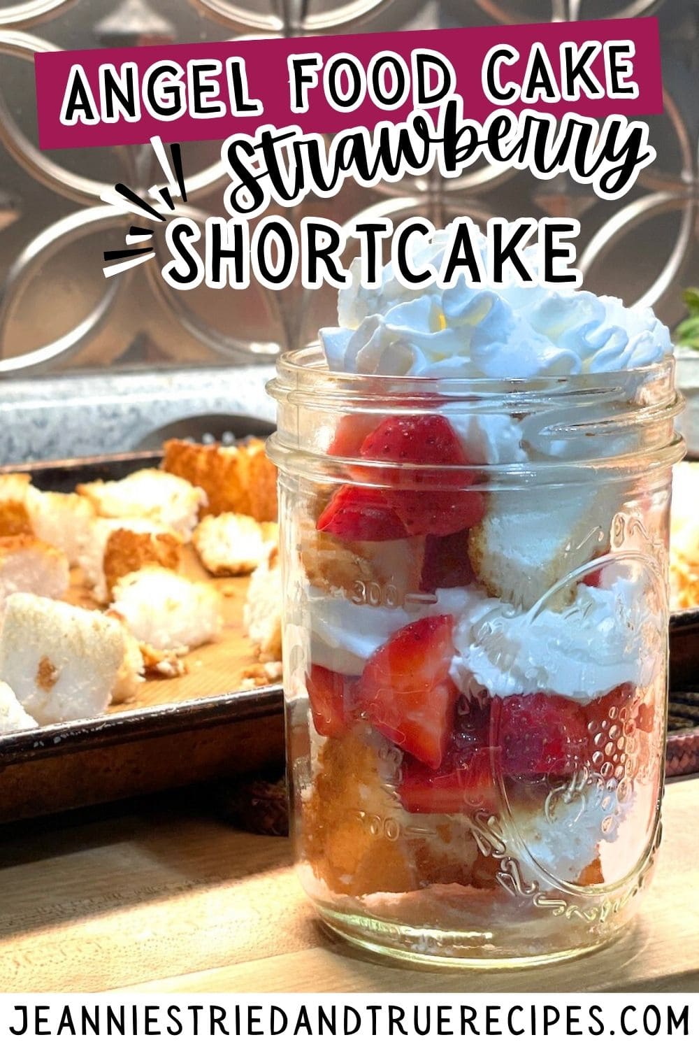 A pin image of strawberry shortcake angel food cake in a mason jar with whipped cream on top and toasted cake in the background.