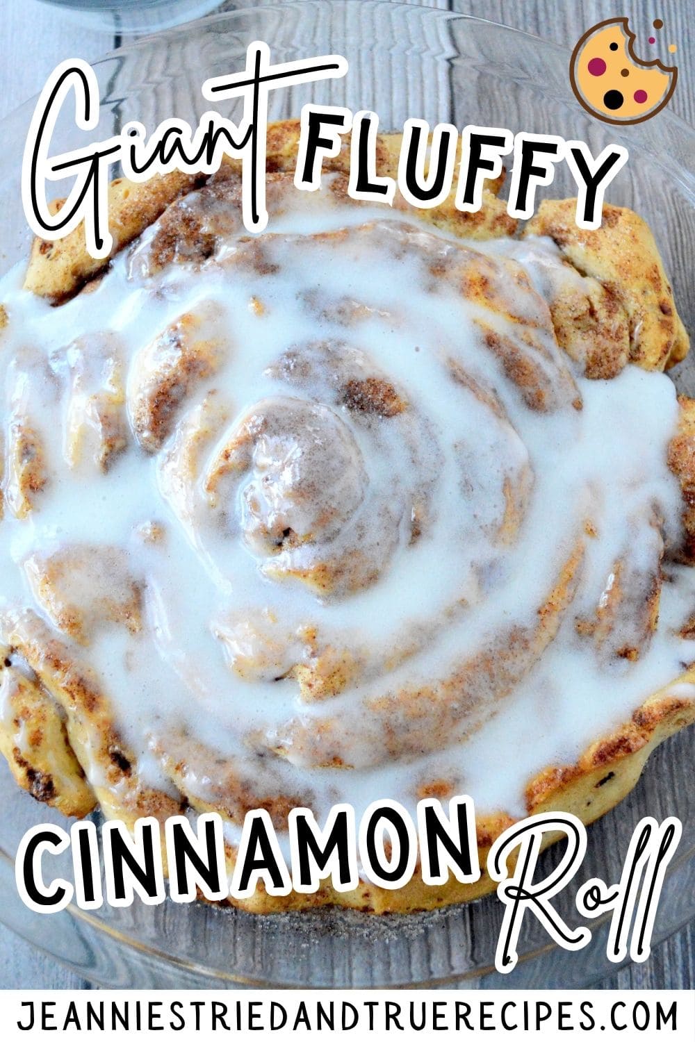 A pin image of a giant cinnamon roll covered in icing.