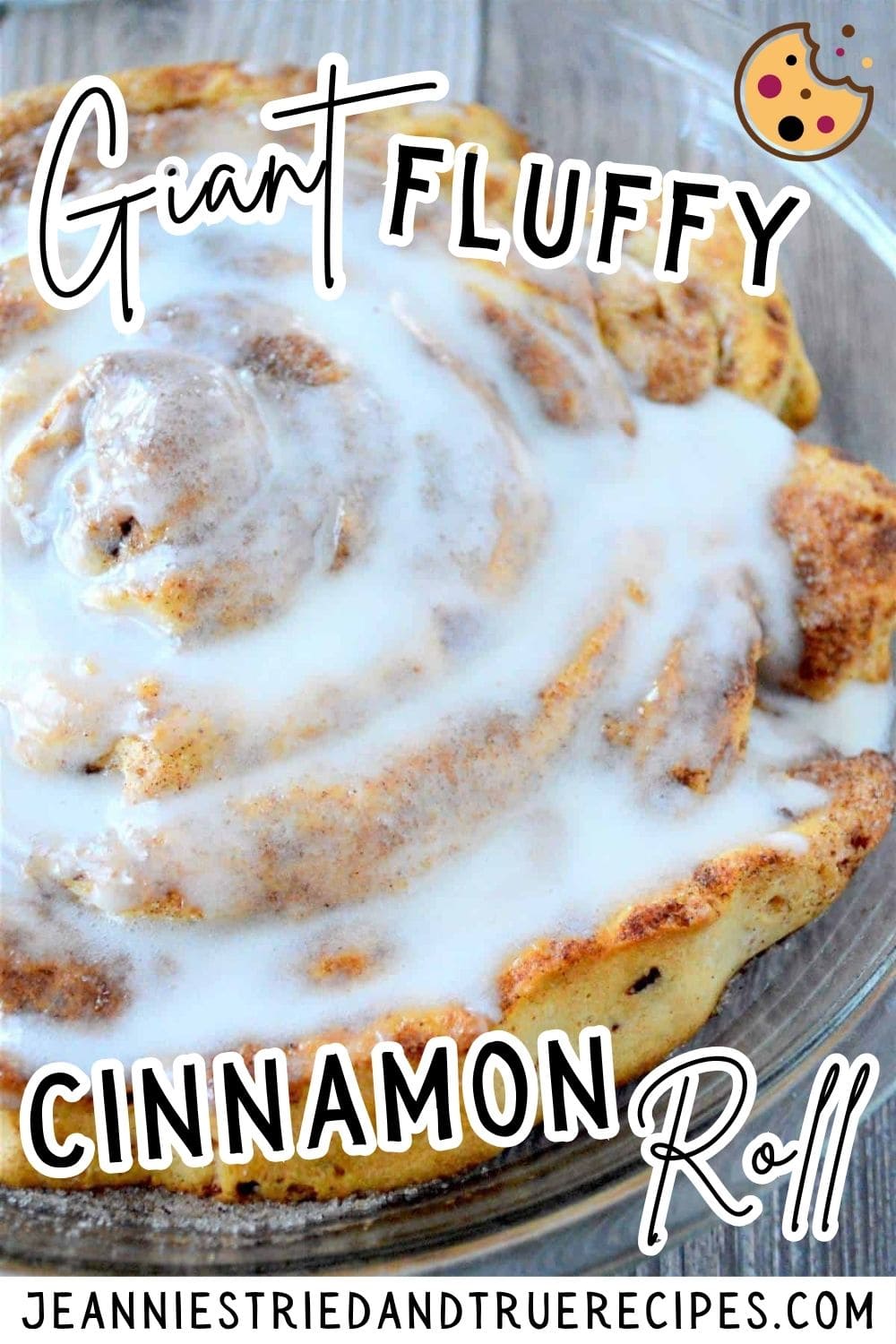 A pin image of a giant fluffy cinnamon roll covered in icing.